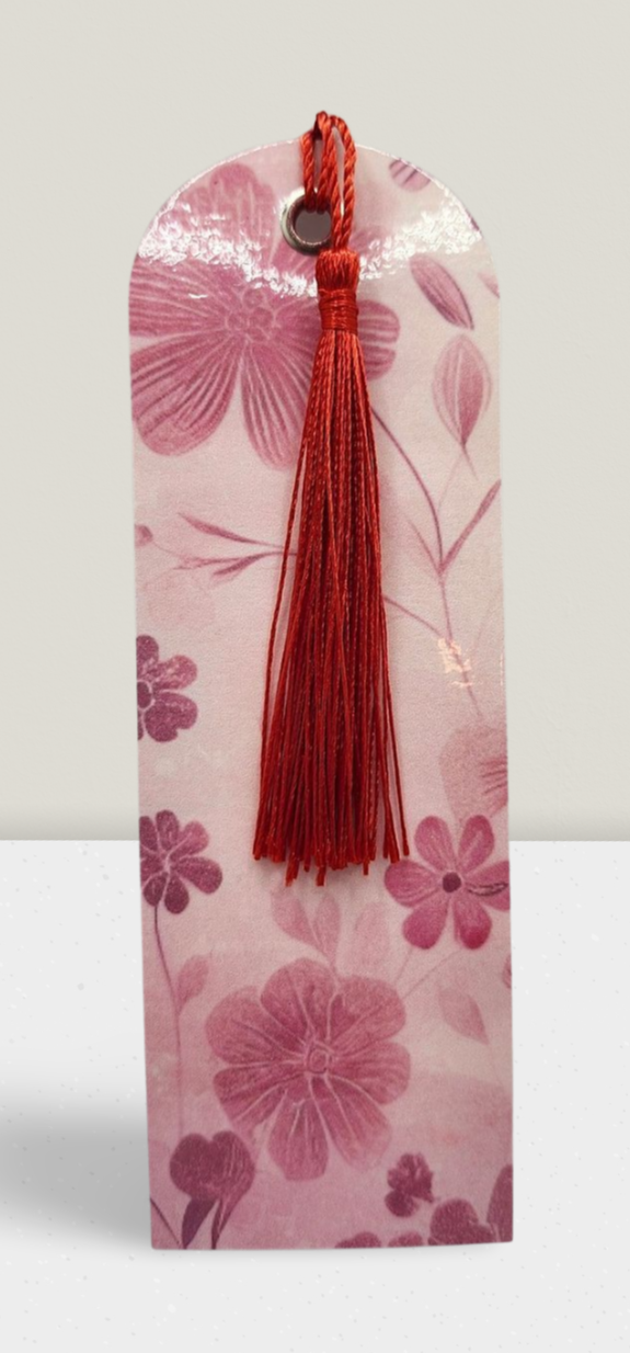 Floral bookmark with a red tassel on a white background