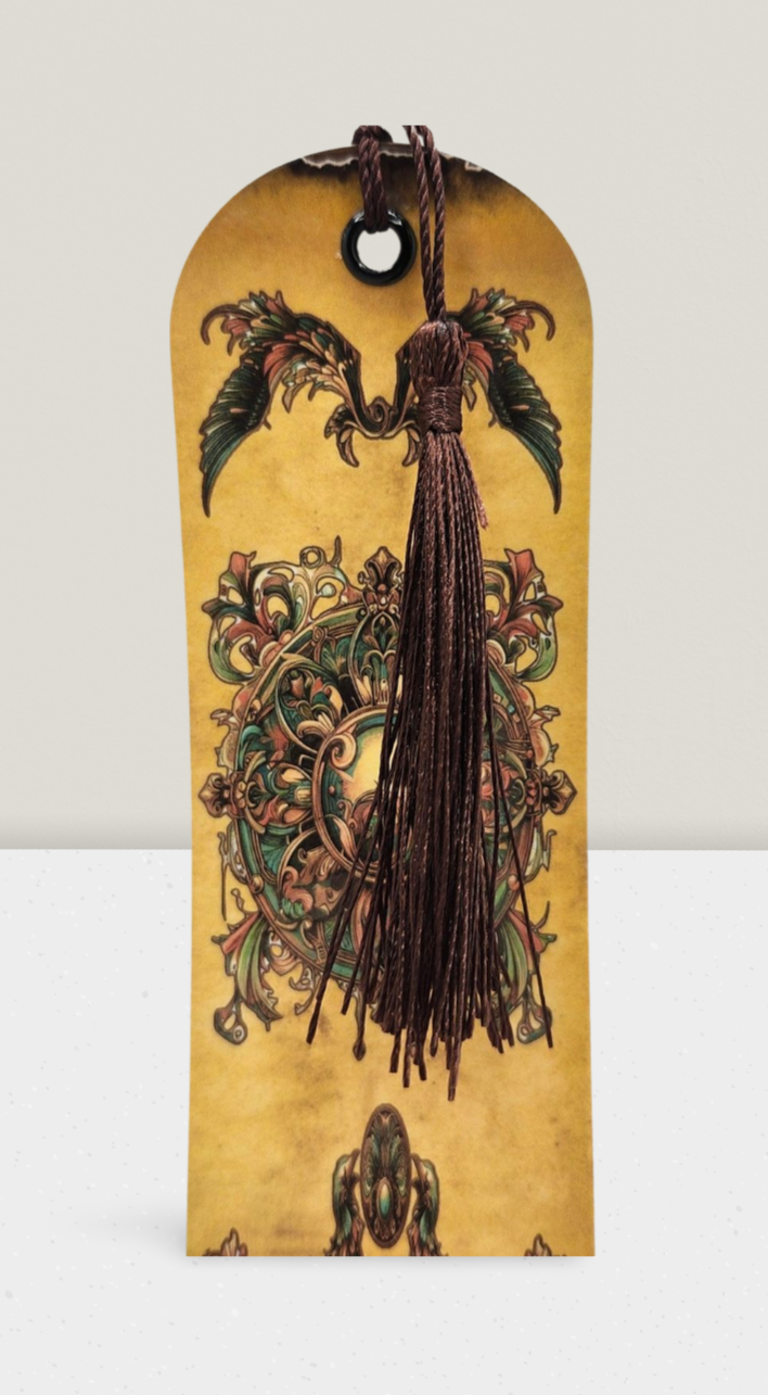 Decorative bookmark with intricate designs and a tassel on a beige background