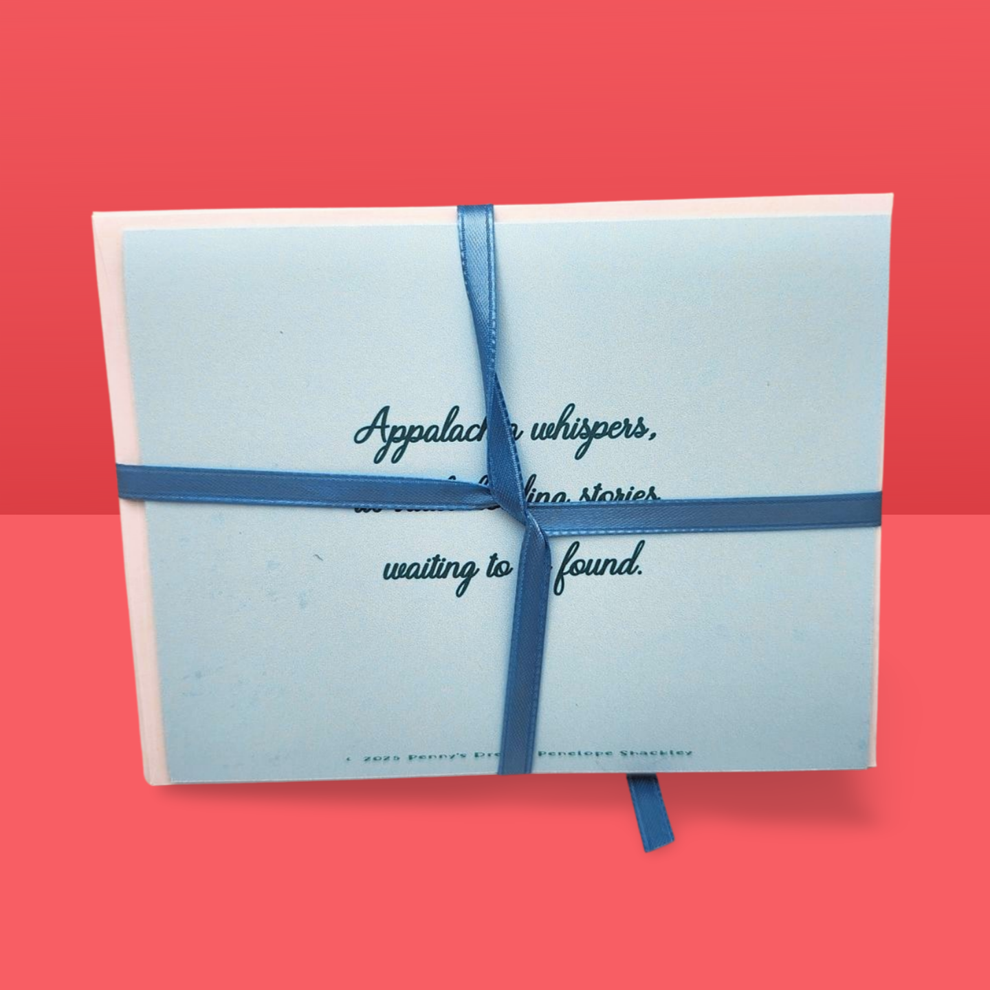 Light blue box with a blue ribbon on a red background