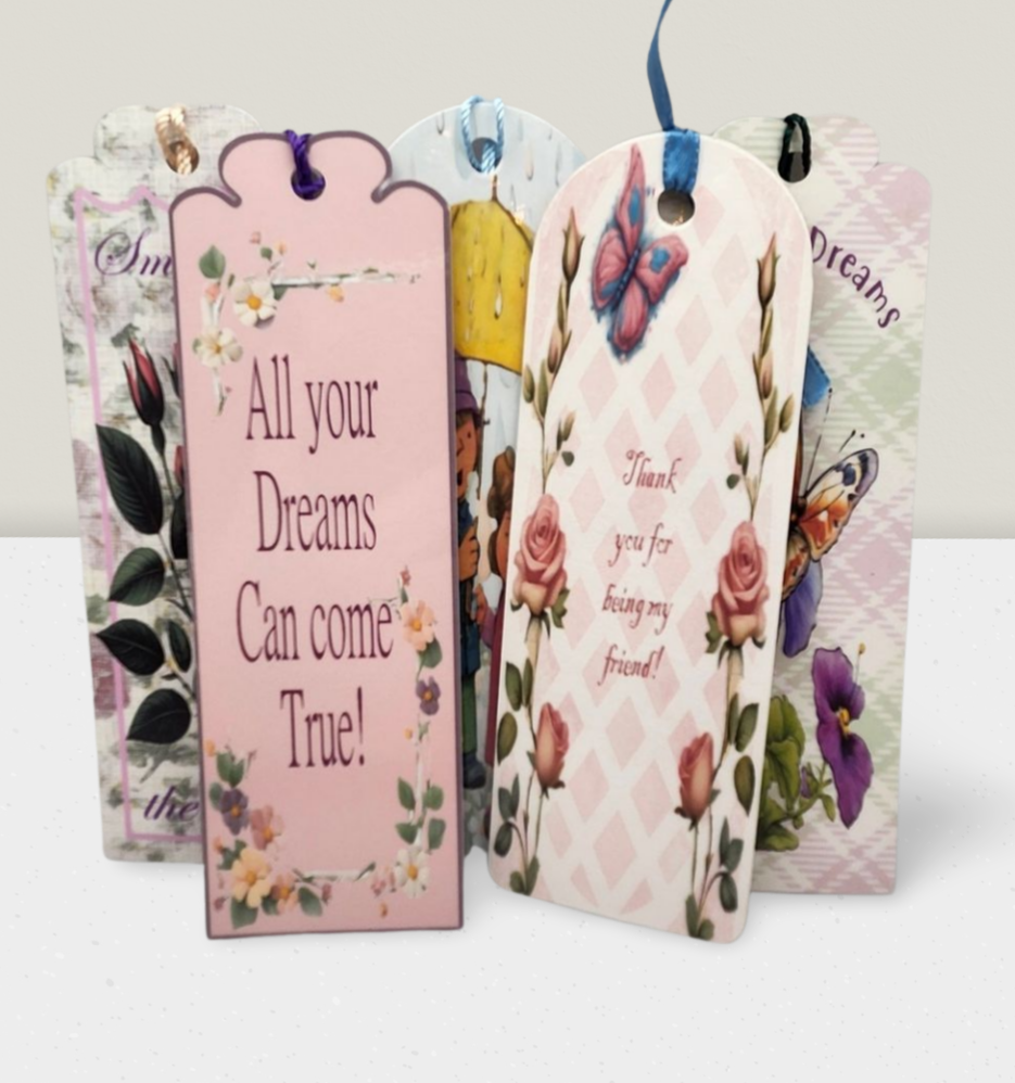 Decorative gift tags with floral designs and motivational phrases on a white background