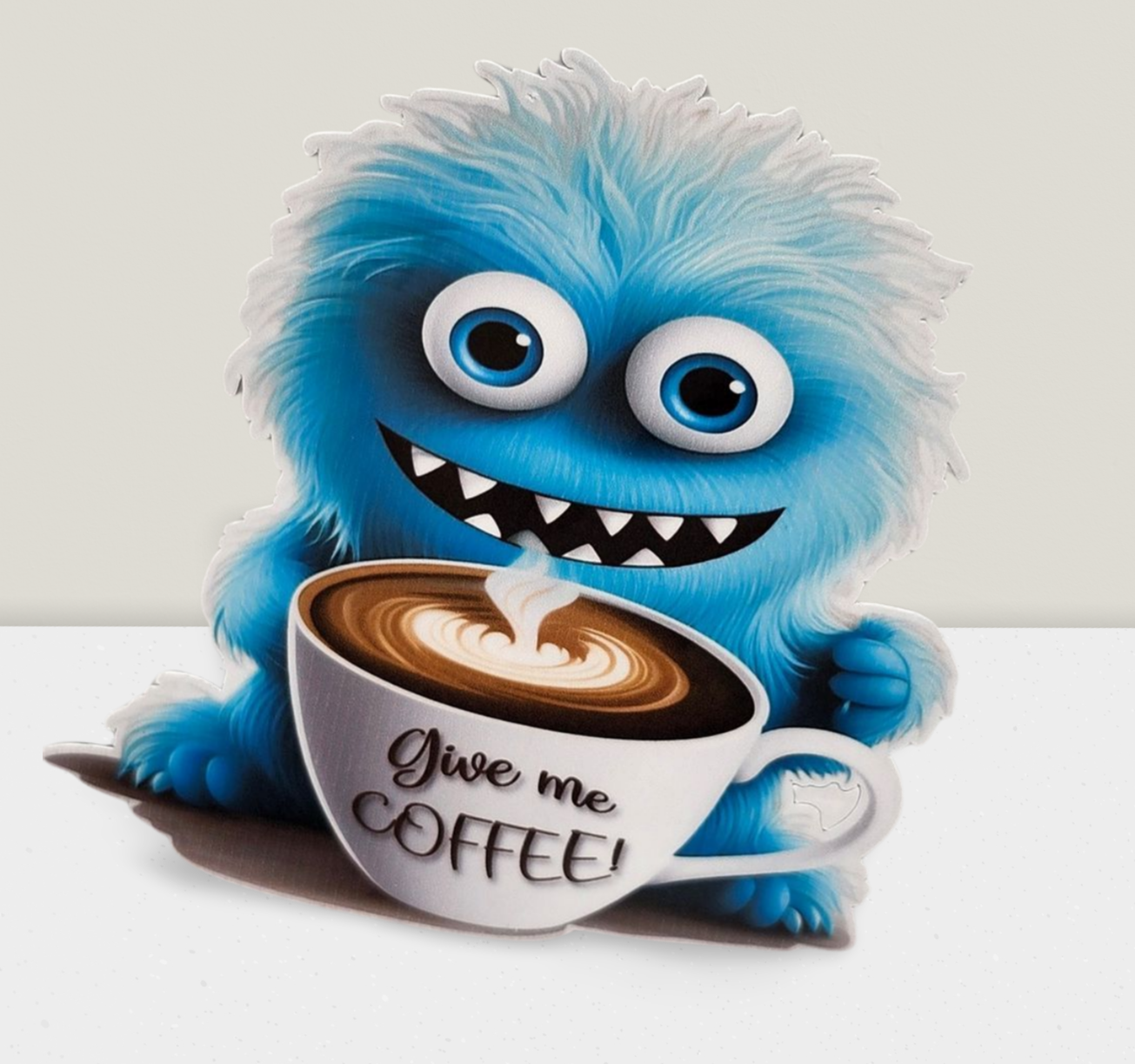 Blue fluffy creature holding a coffee cup with 'Give me Coffee!' text on a white background