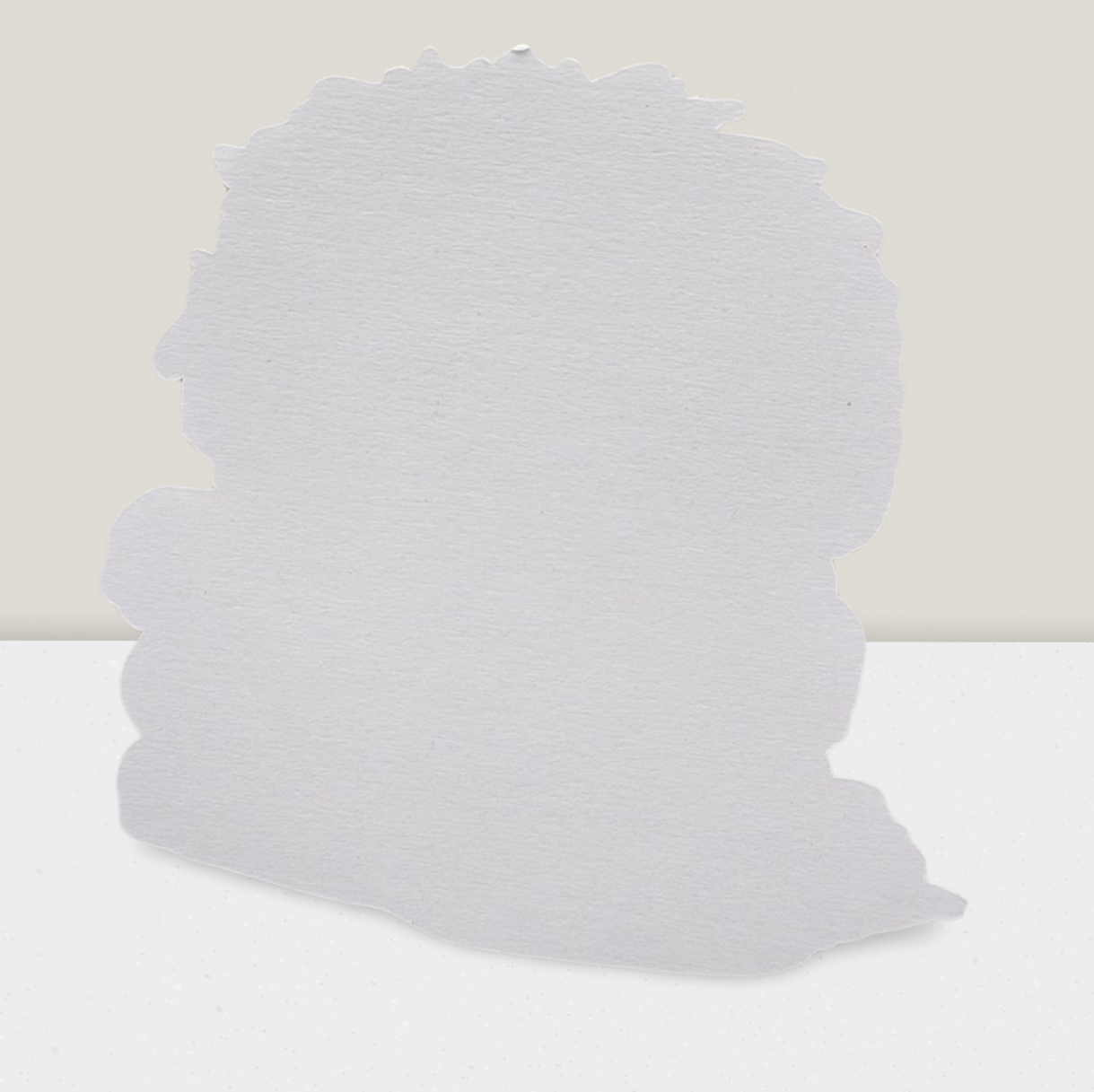 Stack of light gray pillows on a white background