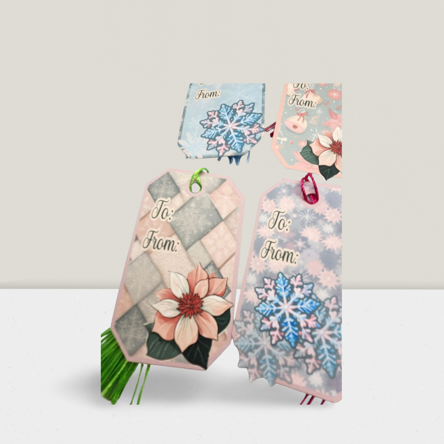 Decorative gift bags with floral and snowflake designs on a light gray background