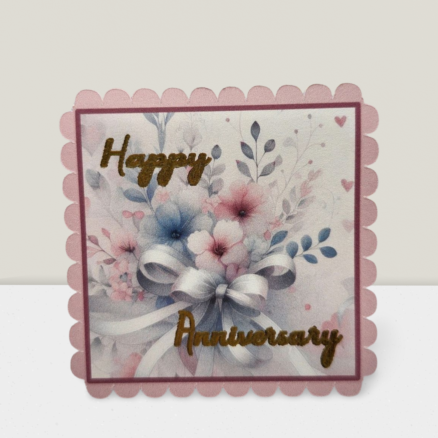 Greeting card with floral design and 'Happy Anniversary' text on a white background