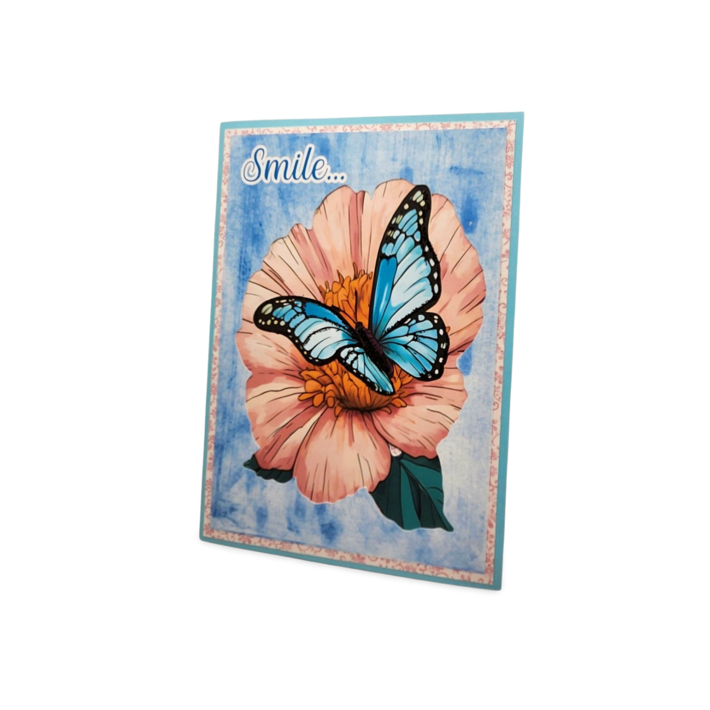 Decorative card with a butterfly on a flower and 'Smile' text on a blue background