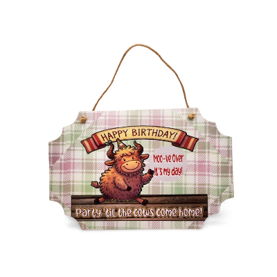 Birthday sign with cartoon cow and plaid pattern on a white background