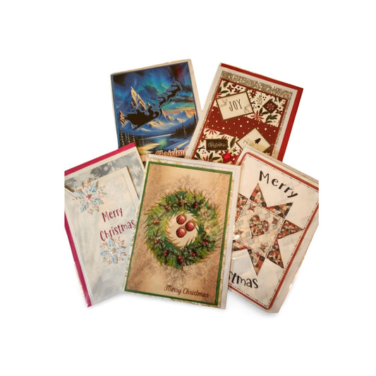 Collection of Christmas cards with various designs on a white background