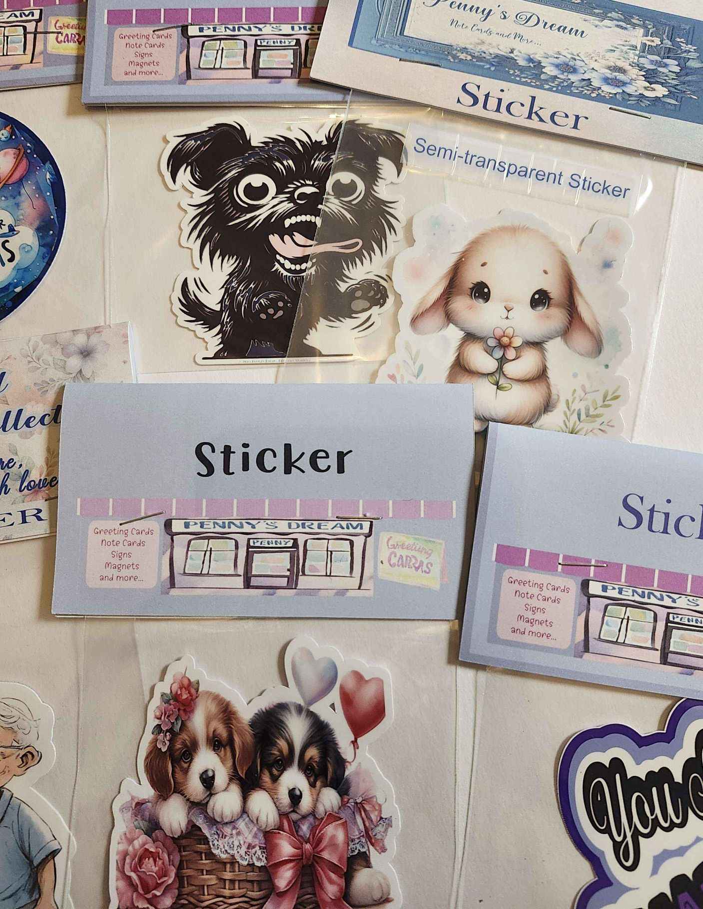 Collection of stickers with various designs including a dog, a rabbit, and puppies with bows.