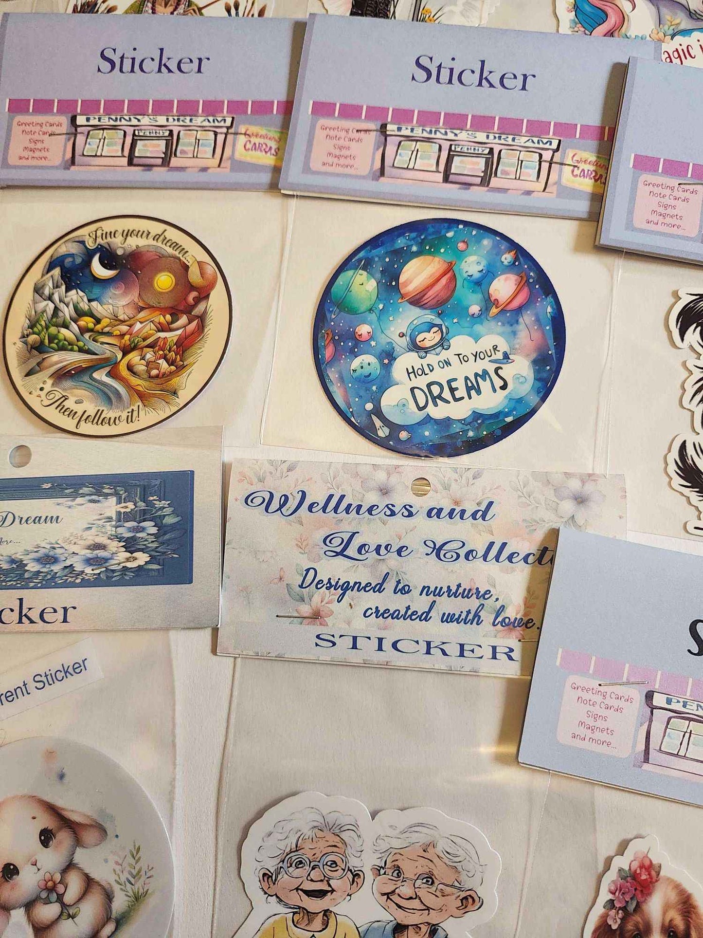 Collection of sticker sheets with various designs on a textured surface