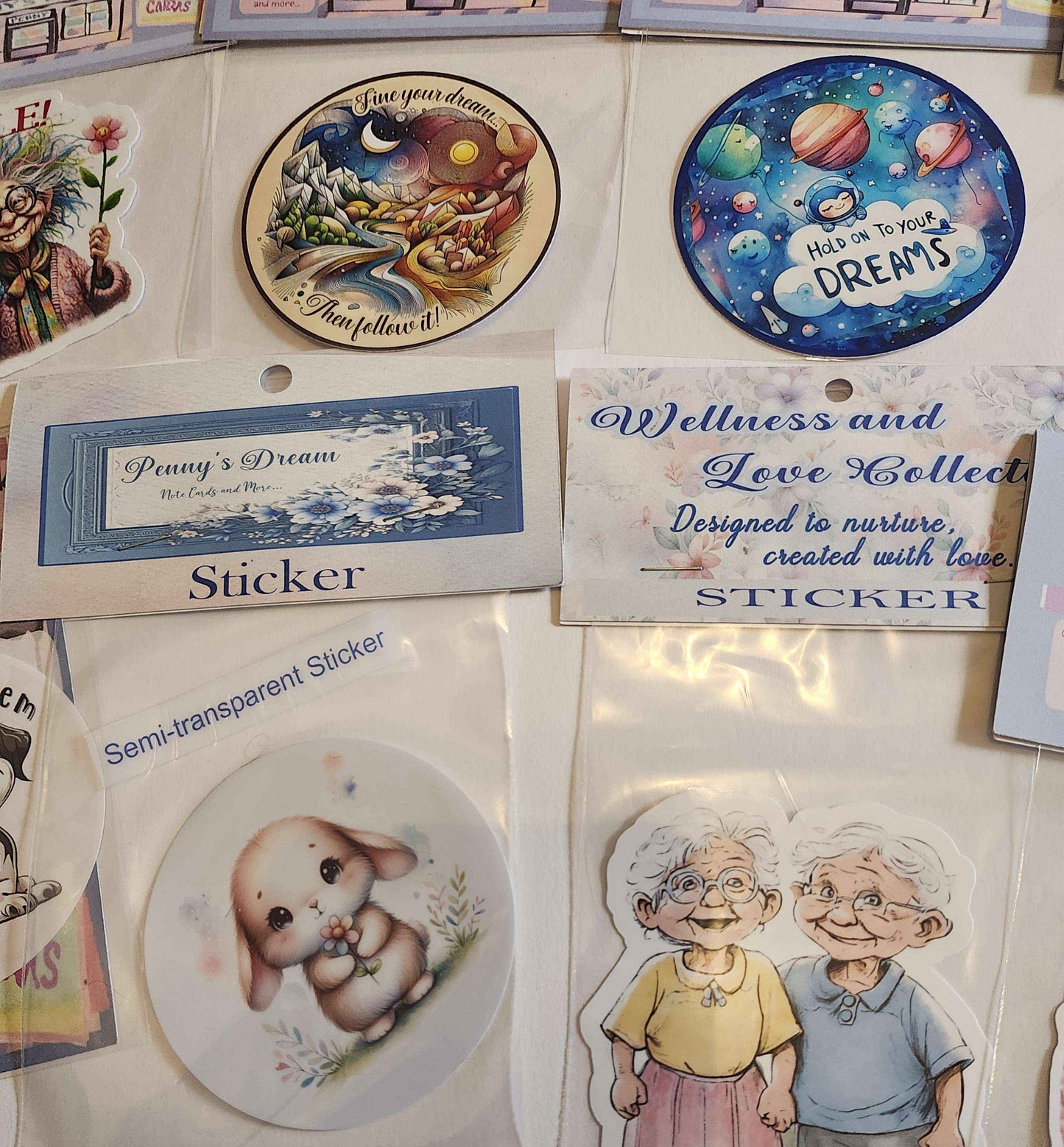 Collection of stickers with various designs and text on a display board.
