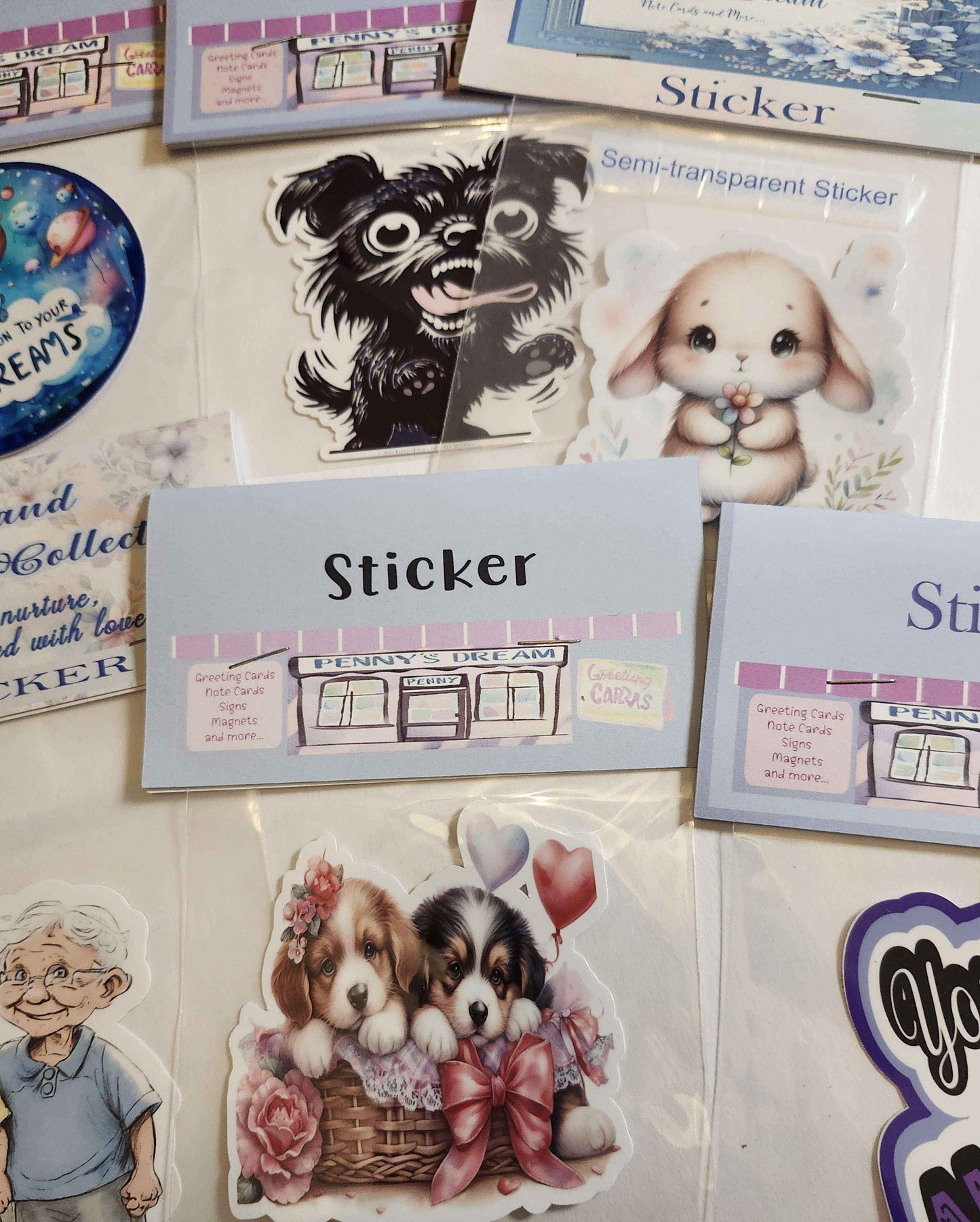 Collection of stickers featuring animals and a store front on a white surface.