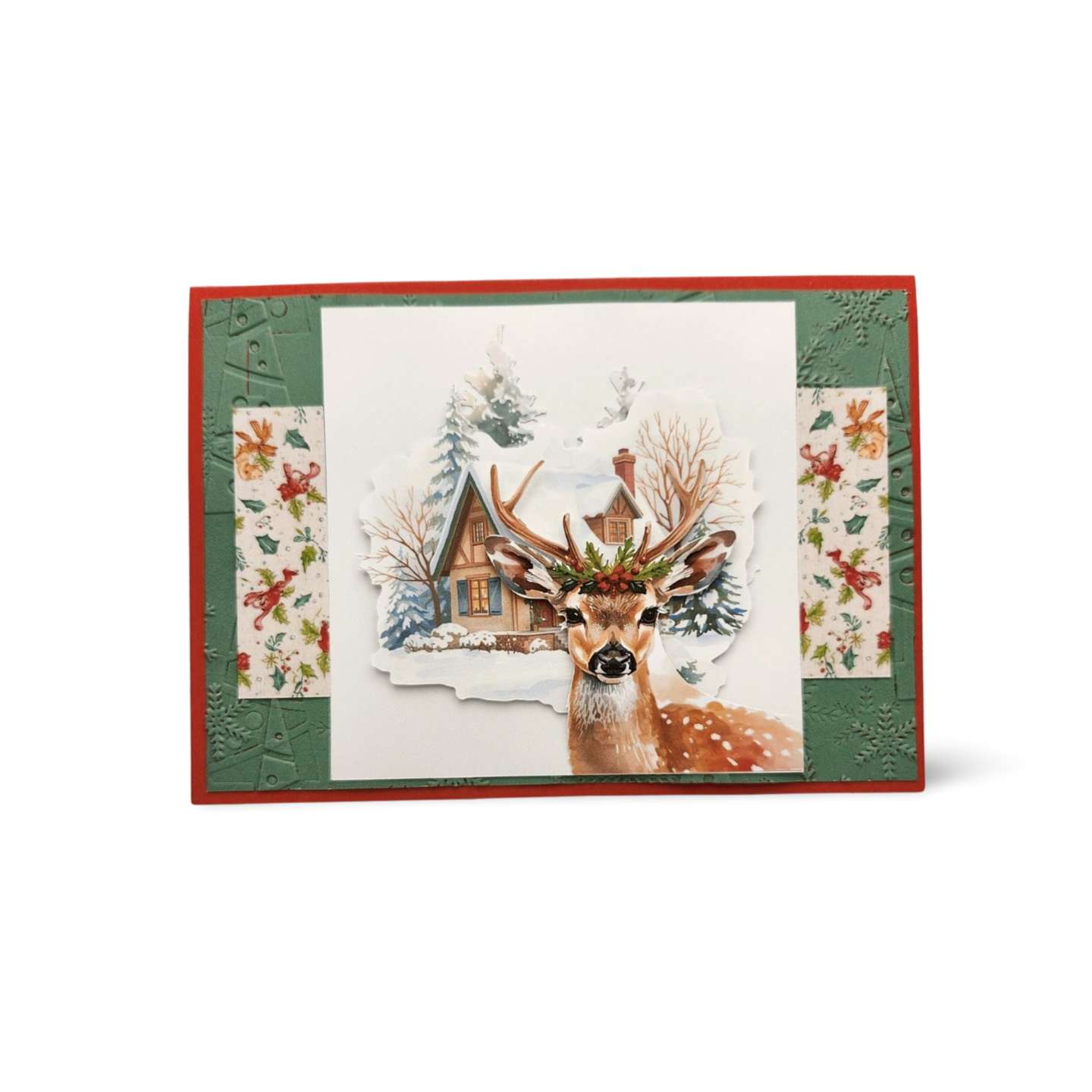 Christmas card with a deer and cabin design on a white background