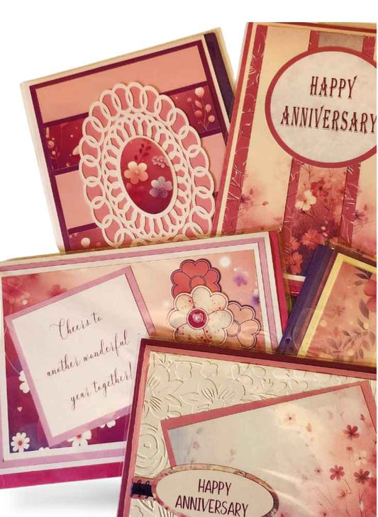 Collection of decorative greeting cards with floral designs and 'Happy Anniversary' text.