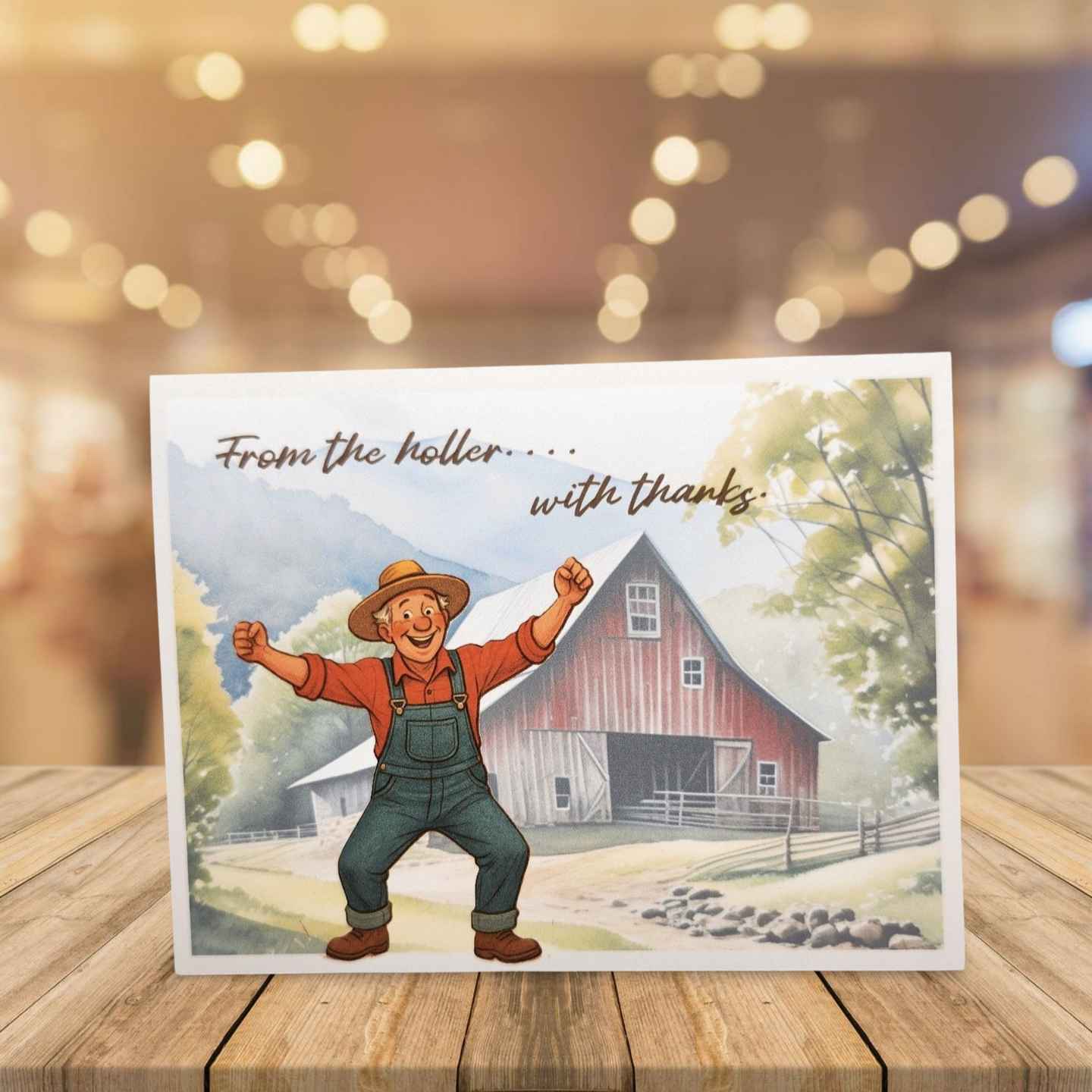 Card with a farmer and red barn illustration on a wooden surface with a blurred background