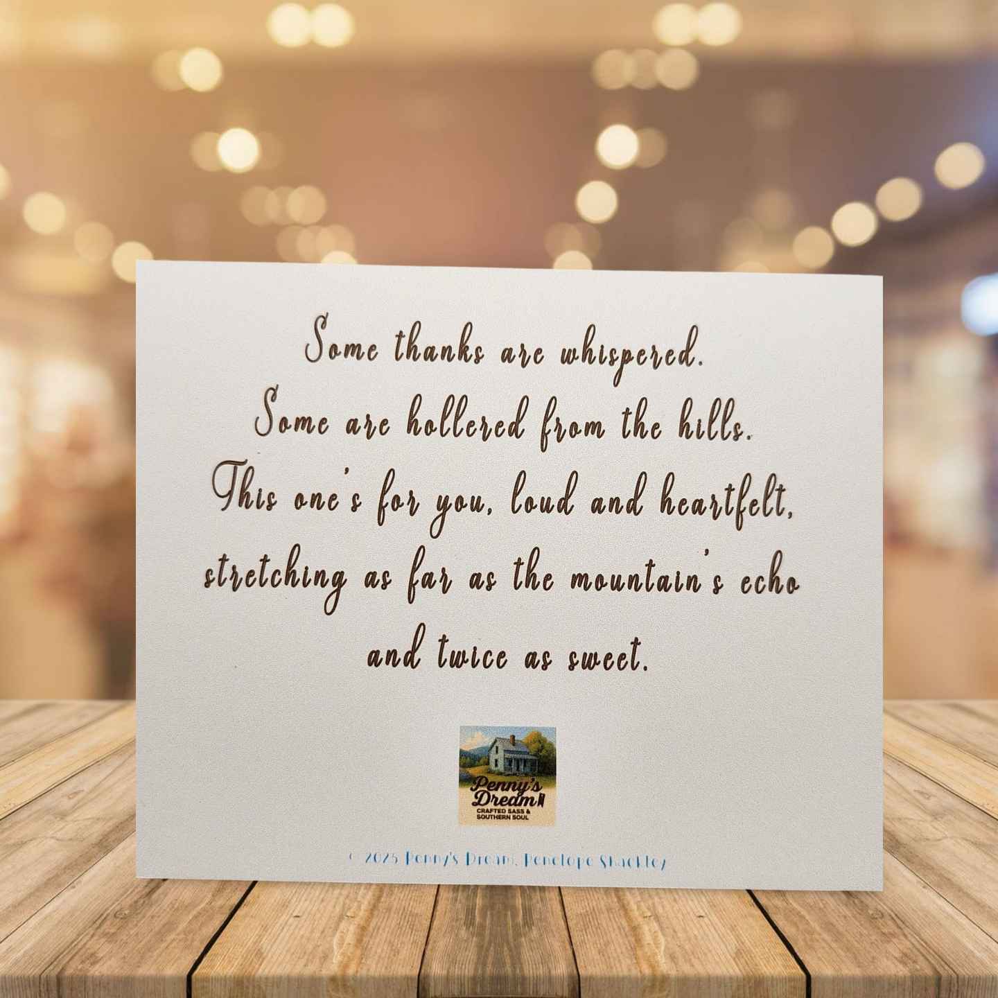 Card with a heartfelt message on a wooden surface with a blurred background