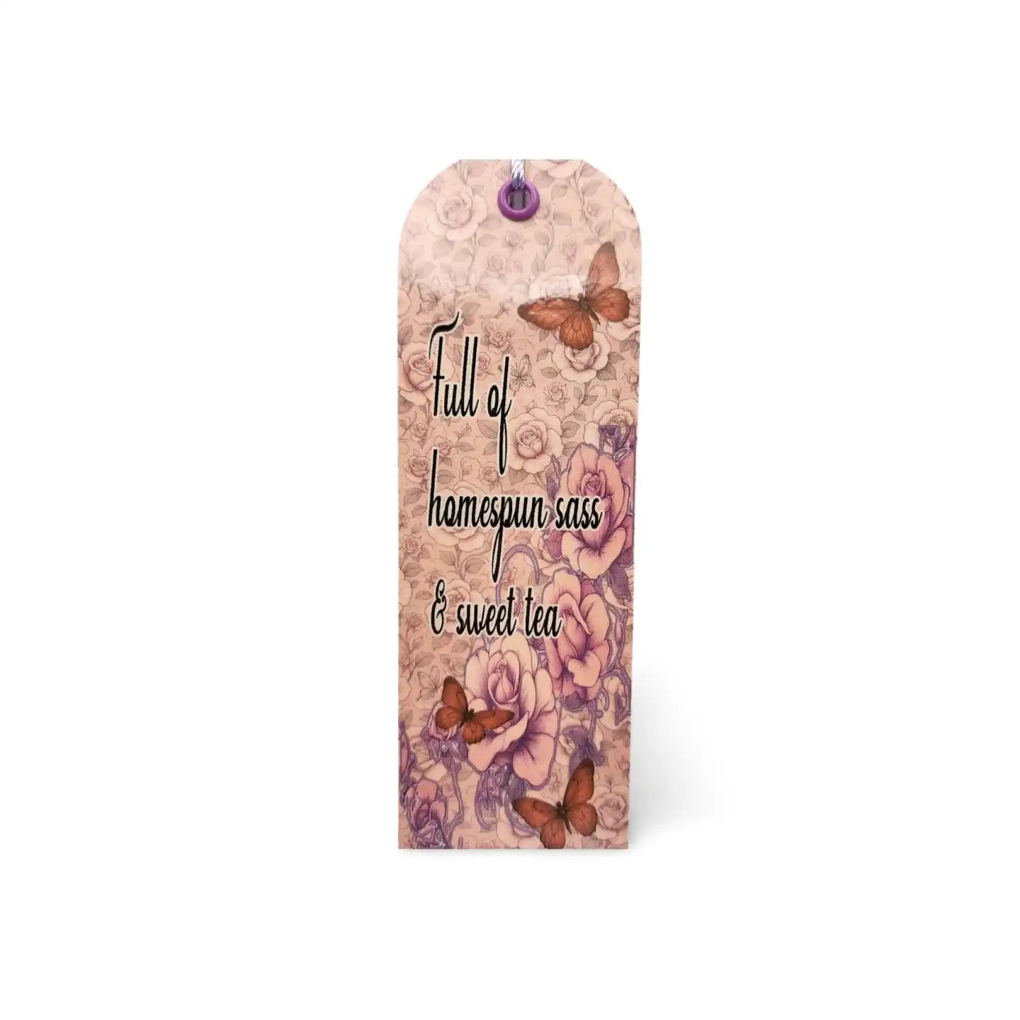 Decorative bookmark with floral design and text on a white background