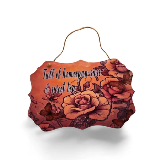 Decorative sign with floral design and text on a white background