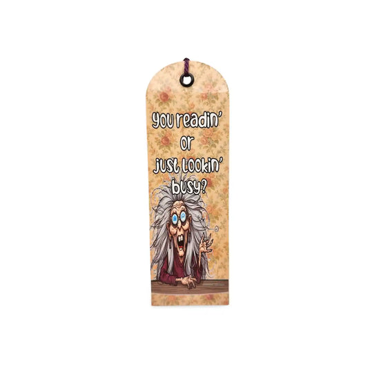 Bookmark with cartoon character and text 'you readin' or just lookin' busy?' on a white background