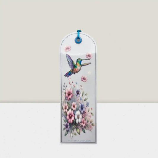 Decorative bookmark with a hummingbird and floral design on a white background
