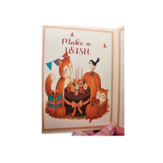 Greeting card with fox, bird, and pumpkin design on a white background