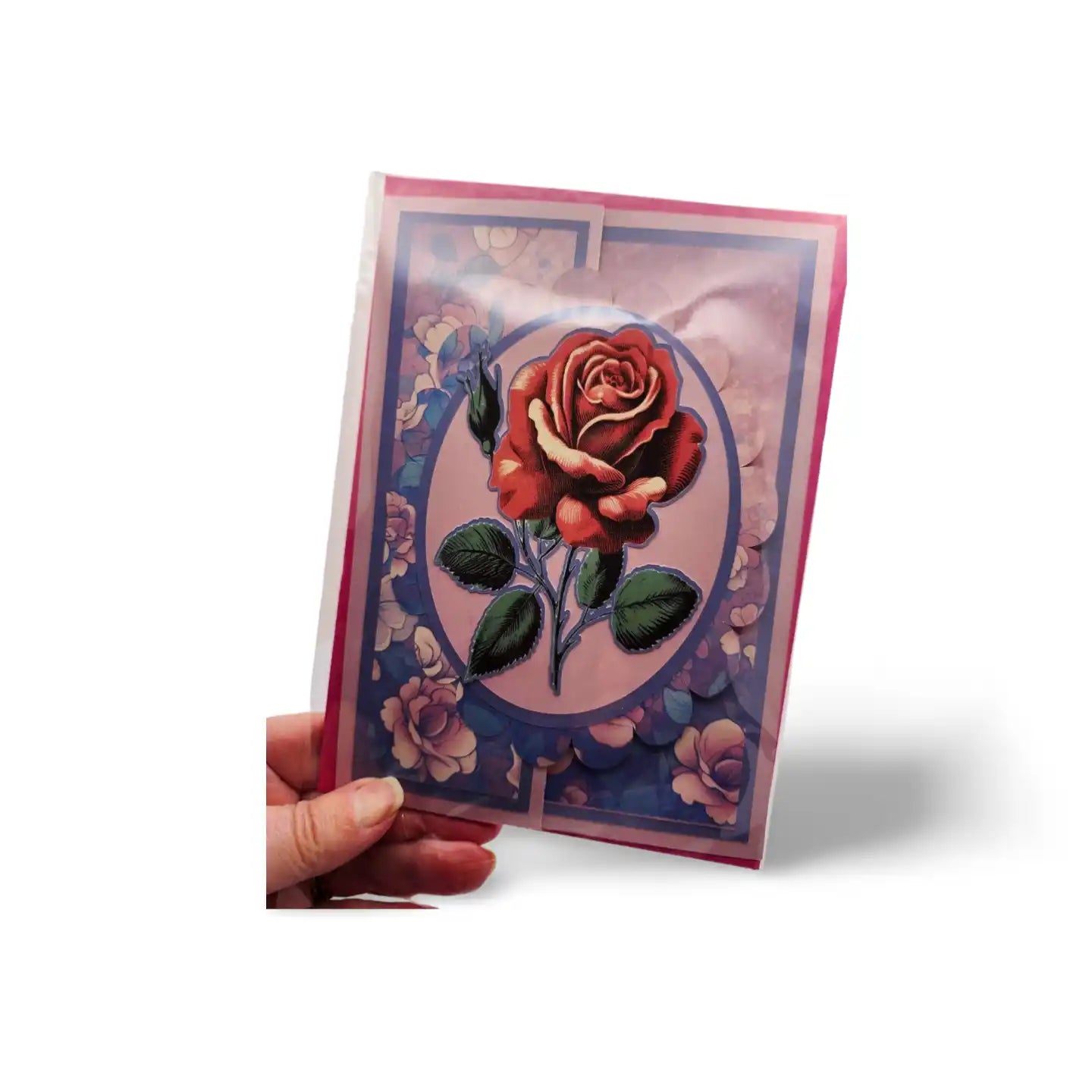 Greeting card with a red rose design held by a hand on a white background