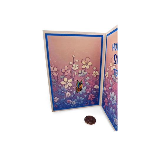 Greeting card with floral design and butterfly on a white background