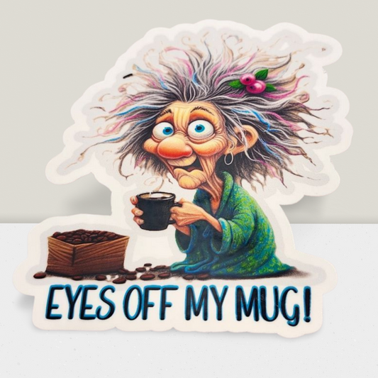 Cartoon character with colorful hair holding a coffee cup with 'EYES OFF MY MUG!' text.