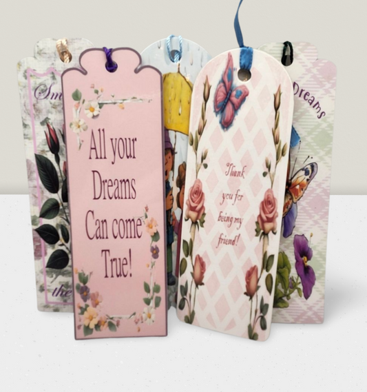 Decorative gift tags with floral designs and motivational phrases on a white background