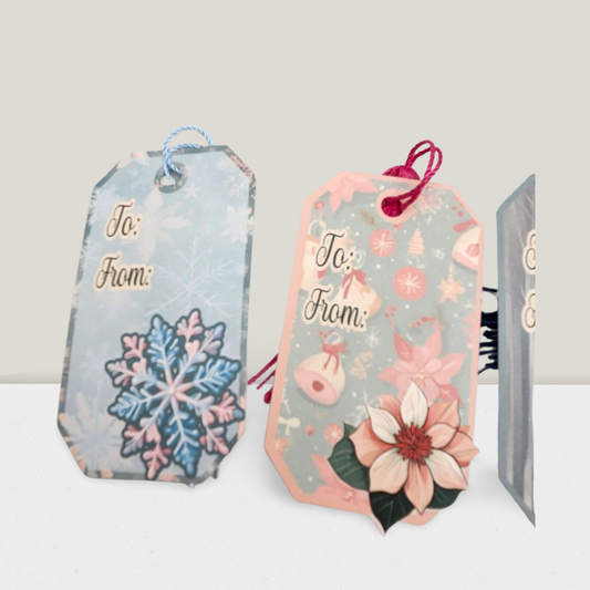 Decorative gift tags with floral and snowflake designs on a white background