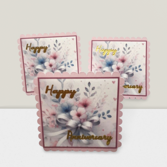 Set of three 'Happy Anniversary' cards with floral designs on a white background