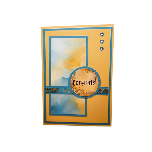 Greeting card with 'Congrats!' text on a yellow background