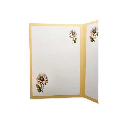 Floral design on a white card with gold border