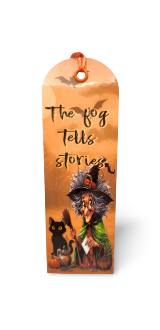 Halloween-themed bookmark with witch design and text on an orange background