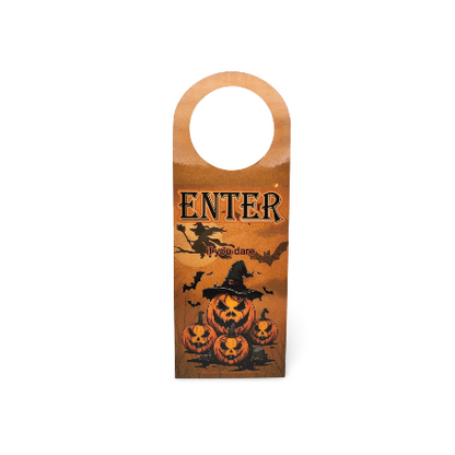Halloween-themed door hanger with pumpkins and text on an orange background