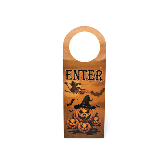 Halloween-themed door hanger with pumpkins and text on an orange background