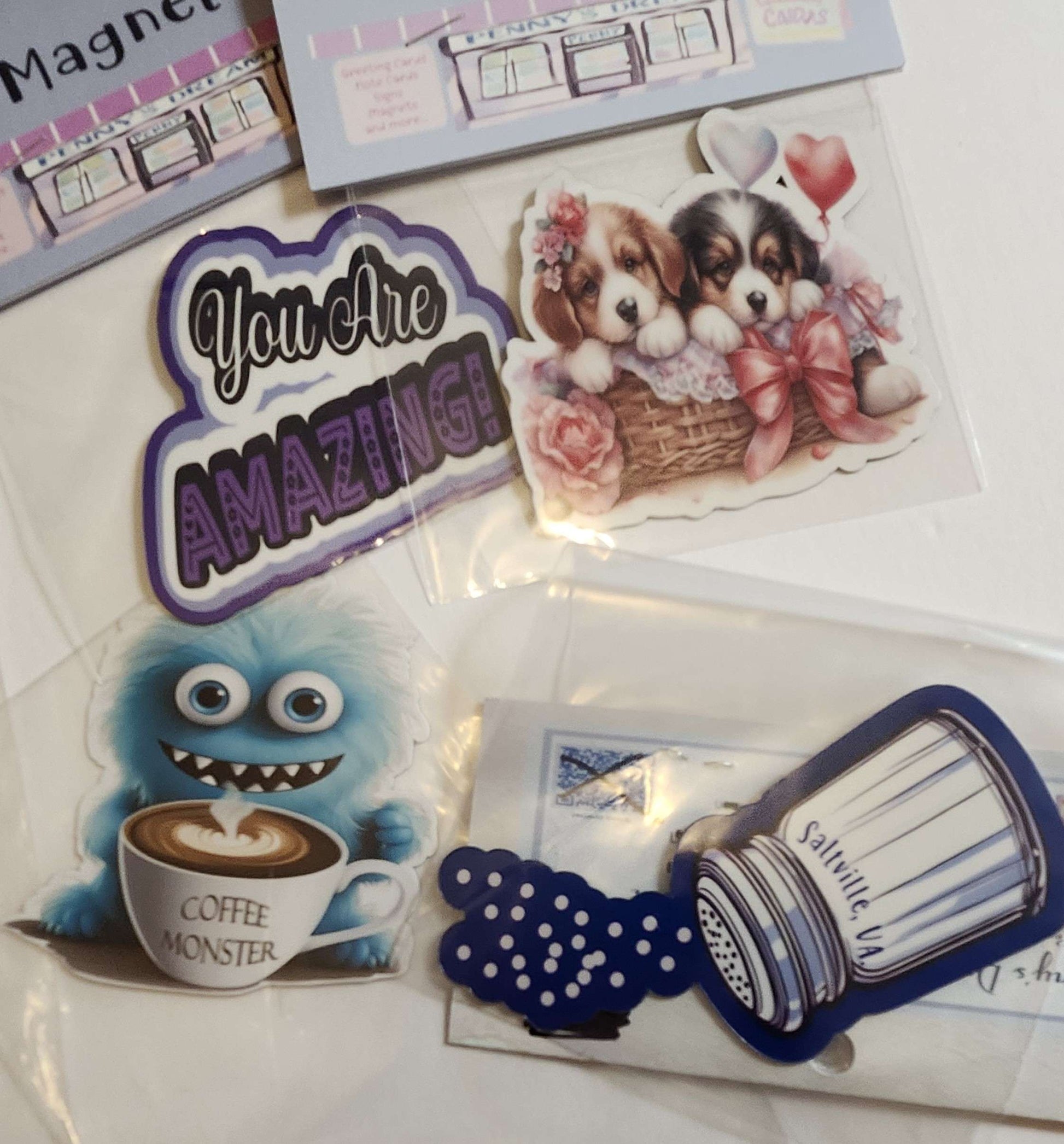 Collection of decorative magnets with various designs on a white surface
