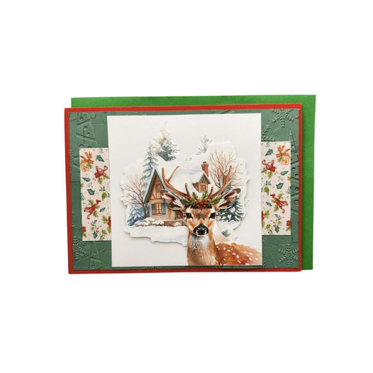 Christmas card with a deer and cabin design on a white background