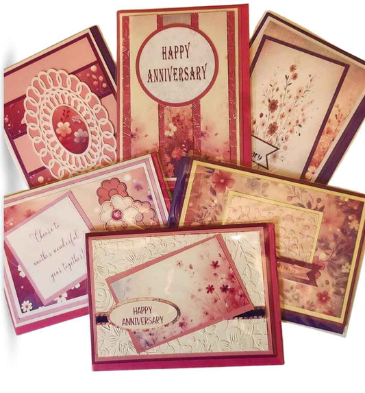 Collection of decorative greeting cards with 'Happy Anniversary' text on a white background