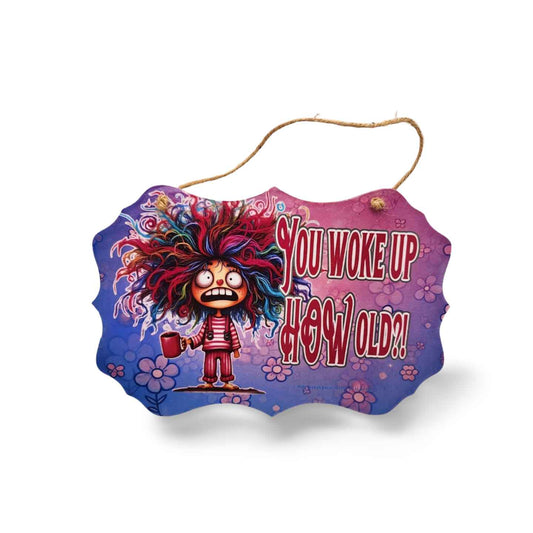 Colorful sign with cartoon character and text 'YOU WOKE UP HOW OLD?!' on a white background