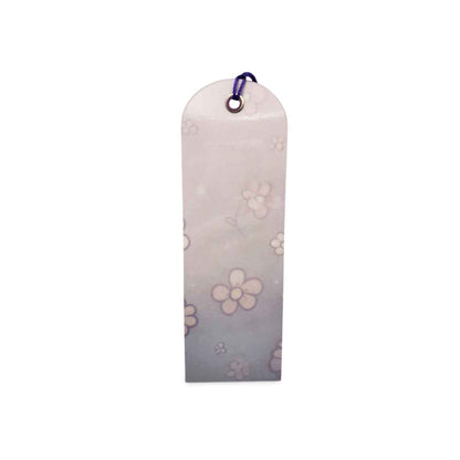 Floral-patterned pouch with a purple clip on a white background