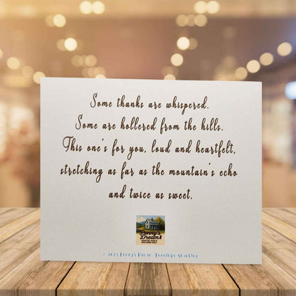 Card with a heartfelt message on a wooden surface with a blurred background