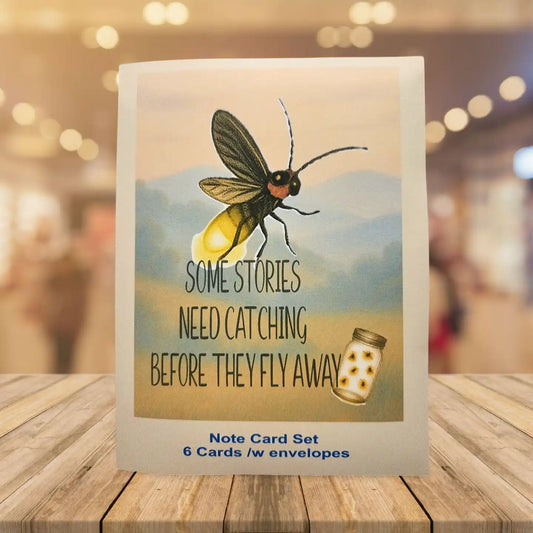 Note card set with a butterfly illustration and text on a wooden surface.