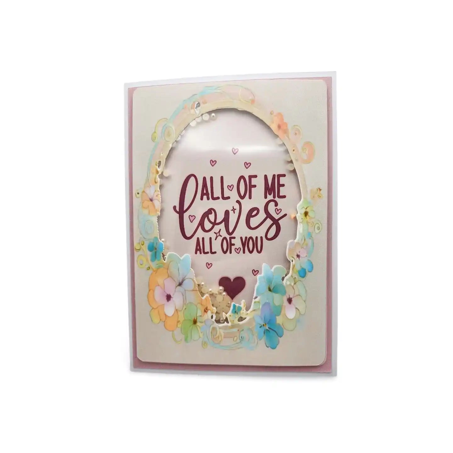 Greeting card with floral design and text 'All of me loves all of you' on a white background