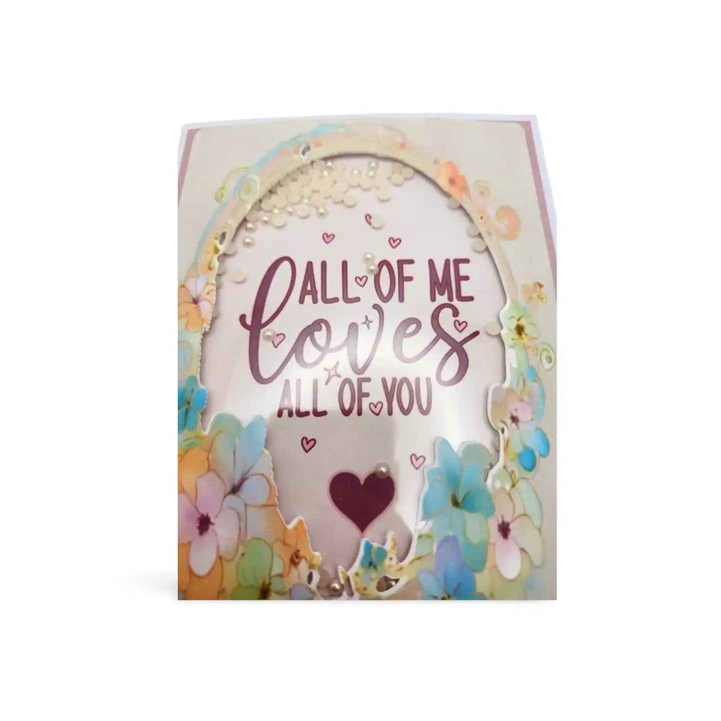 Greeting card with floral design and text 'All of me loves all of you' on a white background