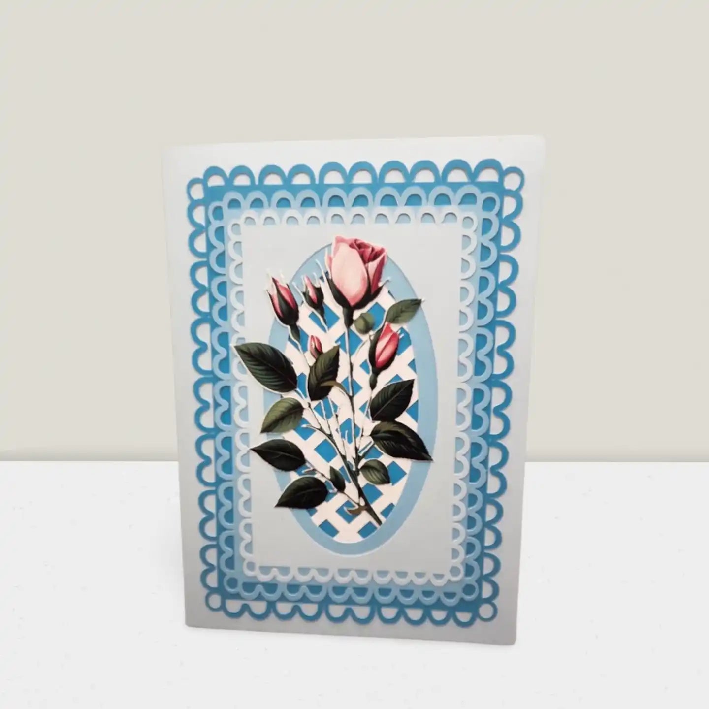 Card with floral design and blue decorative border on a white background