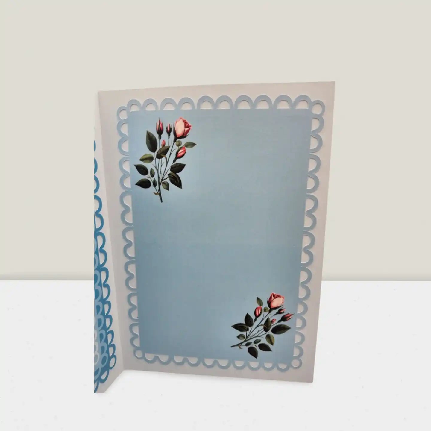 Greeting card with floral design on a light blue background