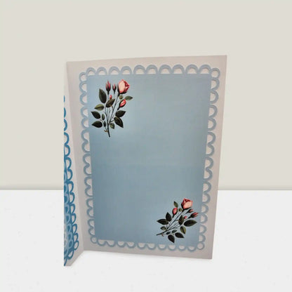 Greeting card with floral design on a light blue background