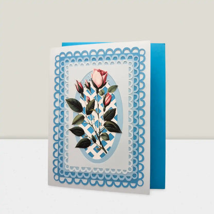 Greeting card with floral design and blue decorative border on a white background