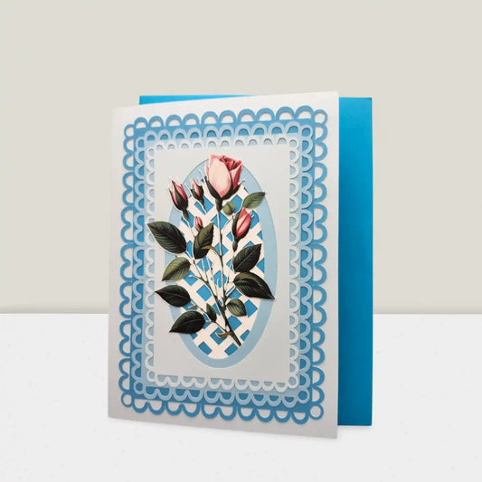 Greeting card with floral design and blue decorative border on a white background