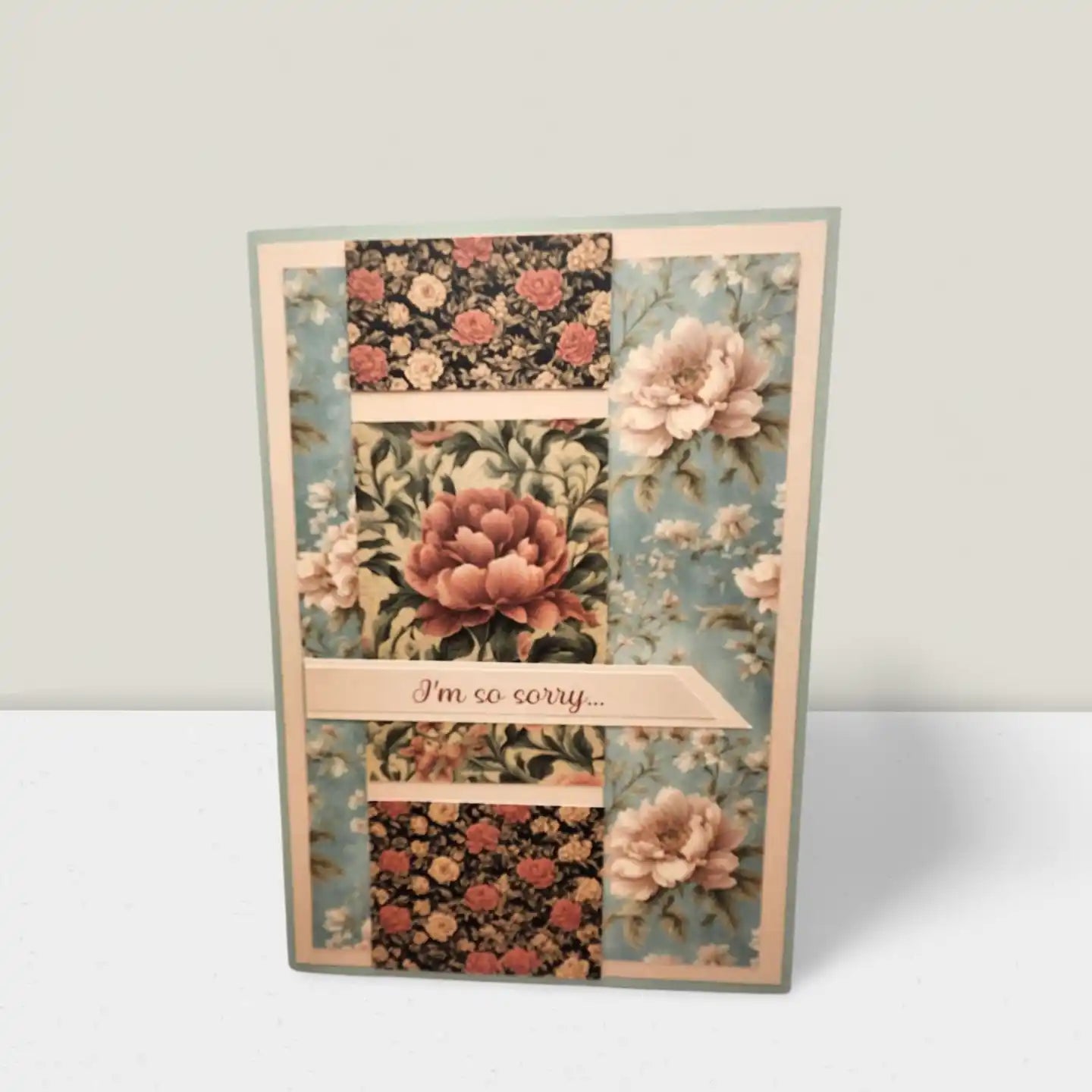 Floral patterned card with 'I'm so sorry' text on a white background